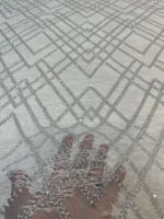 ⁦قماش تول "أبيض ثلجي" بتطريز هندسي كريستالي⁩ - الصورة ⁦2⁩