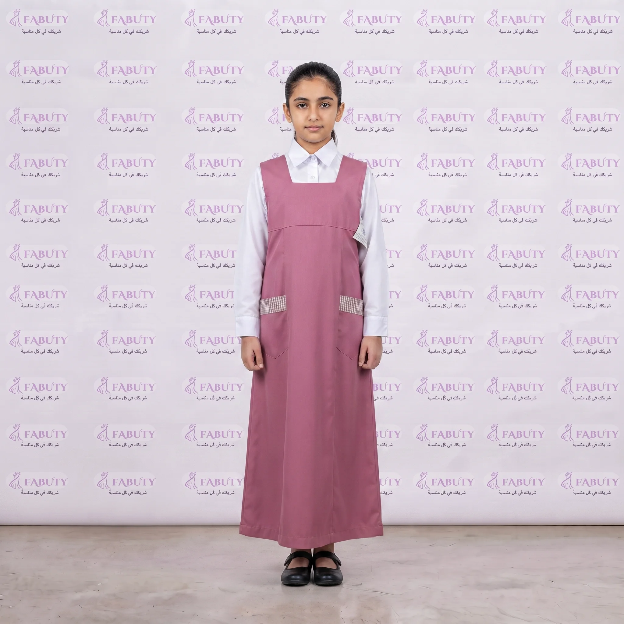 A_full-body_shot_of_a_202607301741 مريول مدرسي خليجي 2ق وردي ابتدائي - الصورة 1